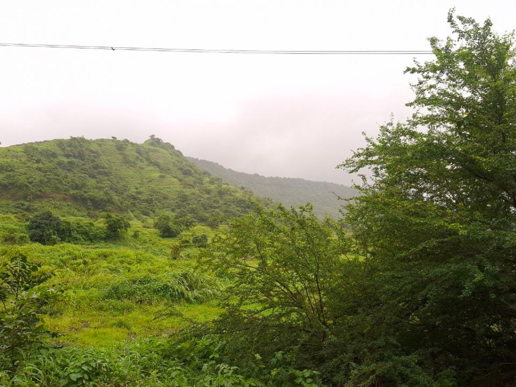 Kharghar Hills from Kharghar Road is visible in this image.