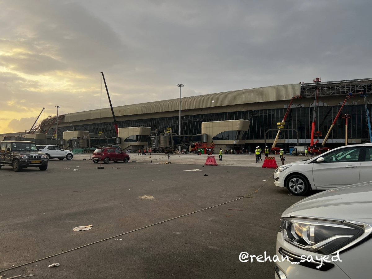 Exterior view of the DB Patil International Airport terminal building at sunset, showing construction nearing completion in September 2025.