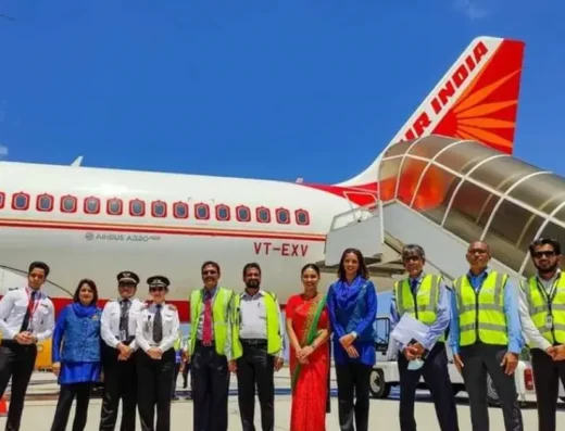 In this image we can see the staffs of an airport with a plane in the background is visible in this image.