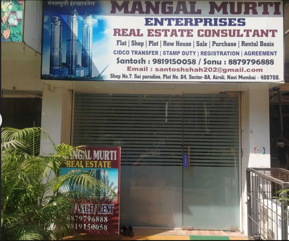 Mangal Murti Real Estate Airoli front door and banner is visible in this image.
